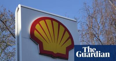 Shell pledges to halve emissions by 2030 as it reports lower profits