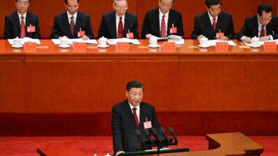 China's Xi downplays need for rapid growth, proclaims Covid achievements