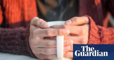 ‘I live under rugs’: people try to keep central heating off as UK bills soar