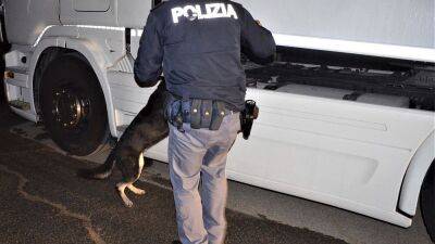 Italian police bust alleged migrant smuggling ring, arresting 12