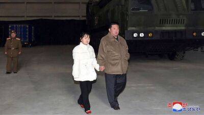 North Korea: Kim Jong-Un reveals 'secret' daughter at missile launch site