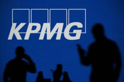 KPMG partner pay jumps 20% on deals boom in scandal-hit year