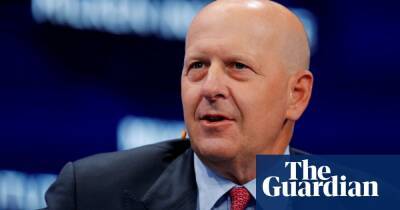 Goldman Sachs pay falls by a third and profits slump as investment boom ends