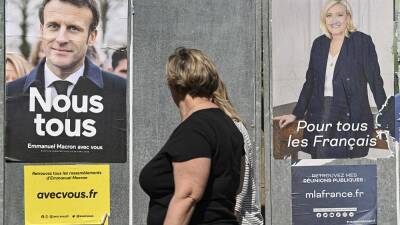 French election: Macron and Le Pen trade blows on final day of campaign