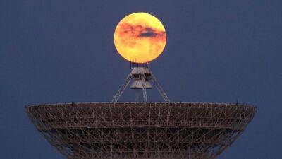 In pictures: Stargazers enjoy super blood moon amid lunar eclipse