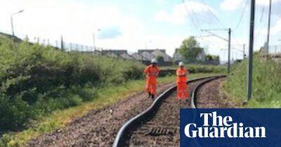 Two UK rail mainlines close as parts of track hit 62C in extreme heat