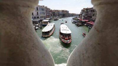 'Imbeciles': Surfers fined for speeding down Venice's Grand Canal