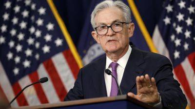 Fed Chair Powell calls talk of cutting rates 'premature' and says more hikes could happen