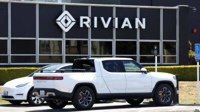 Stocks making the biggest moves midday: Rivian, Western Alliance, Peloton and more