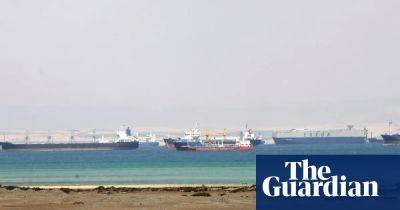 Ship briefly grounded in Suez Canal is refloated
