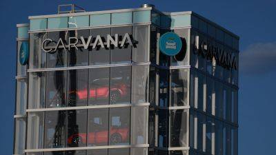Stocks making the biggest moves midday: Carvana, Goldman Sachs, AT&T and more