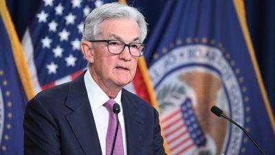 Fed sees more rate hikes ahead, but at a slower pace, meeting minutes show