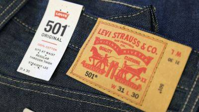 Stocks making the biggest premarket moves: Levi Strauss, Biogen, Alibaba and more