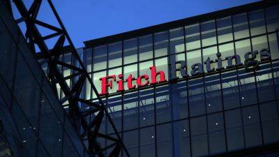 Fitch warns it may be forced to downgrade dozens of banks, including JPMorgan Chase