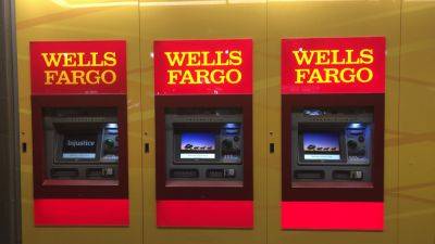 Wells Fargo posts higher fourth-quarter profit, helped by higher interest rates and cost cutting