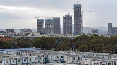 China's housing minister says real estate developers must go bankrupt if necessary