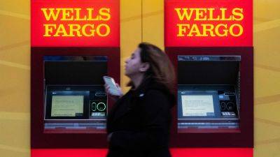 Wells Fargo shares fall as lower interest income cuts into profits