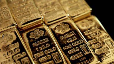 Gold heads for record high close on view that Fed is poised to cut rates